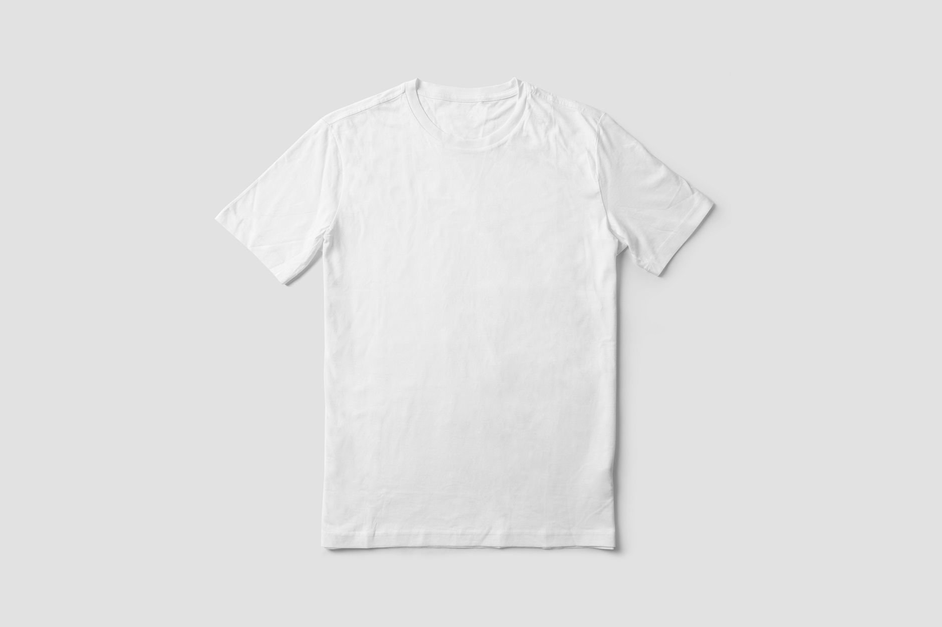 Simple white t-shirt on a light plain background
